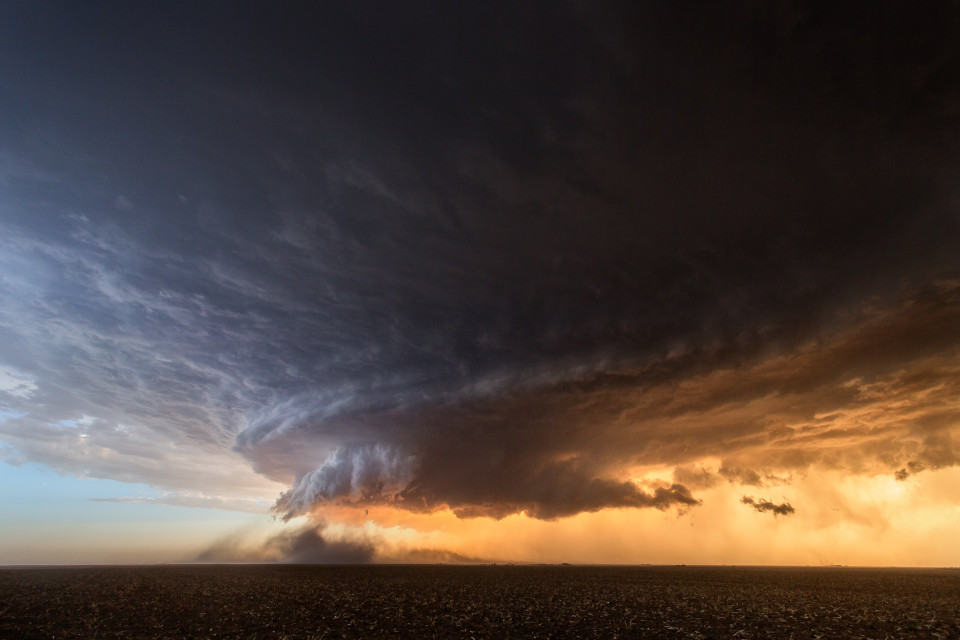 This incredibly photogenic storm near Booker, Texas was like a dust-eating machine. Everything around it seemed to get sucked into the updraft of this stunning supercell. The colors at sunset added to the apocalyptic look of this storm.