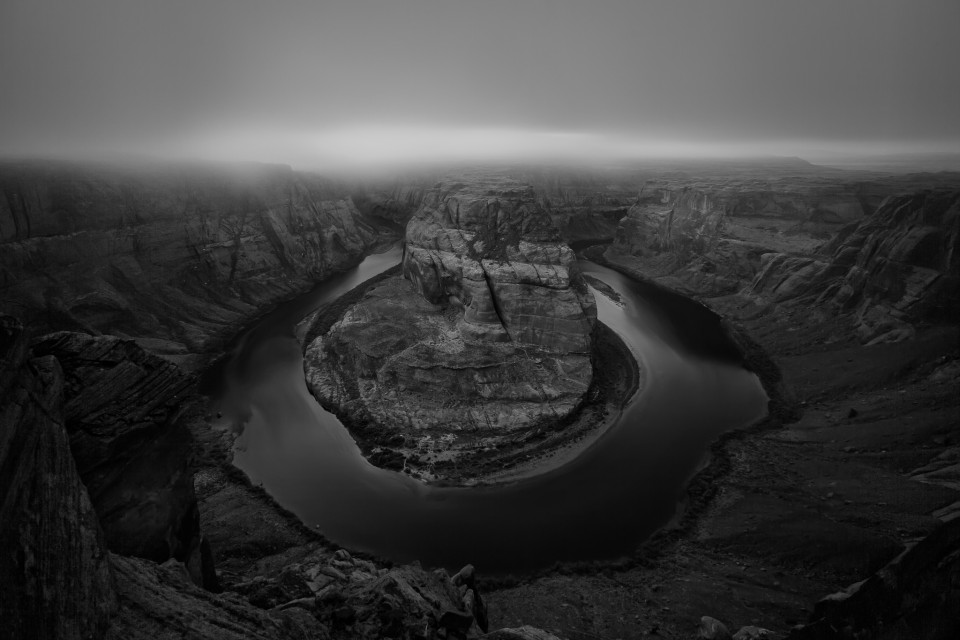 A low layer of fog flows over Horseshoe Bend during an inversion over northern Arizona that lasted for several weeks.