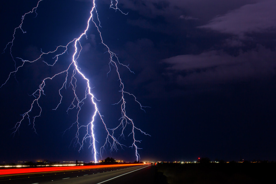 A huge, powerful positive cloud-to-ground lightning strike lands around Gila Bend on September 13th, 2015. Positive strikes are 10 times more powerful than a normal one, and they tend to originate near the top of a thunderstom and can land up to 10 miles away. On this one you'll notice the rain is actually off to the right of the photo, so this strike was well away from there. One of the deadly aspects of lightning.