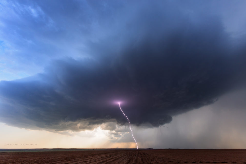 A bolt of lightning escapes an isolated storm south of Paducah, Texas