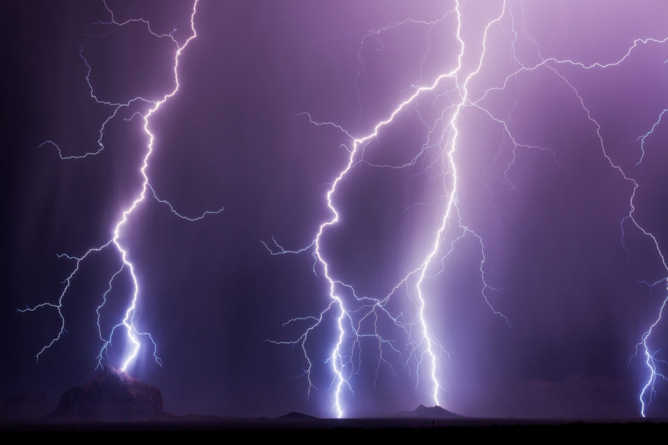 Something like hellfire rains down on these mountains west of Phoenix, with a massive bolt landing right atop Courthouse Rock.