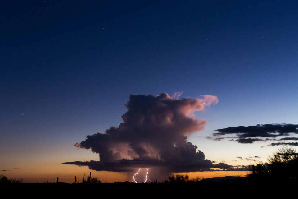 A beautiful, isolated storm hangs in western portions of Arizona right at sunset.